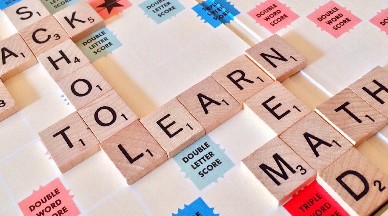 scrabble tiles showing the word learn