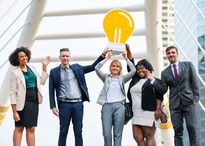 a group of people standing and smiling